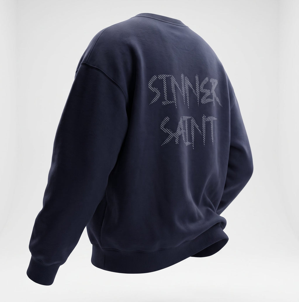 A navy blue Oversized heavyweight sweater with a large text on the back saying Sinner Saint